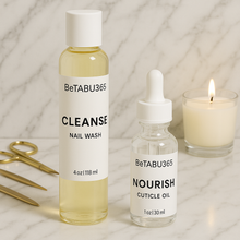 Load image into Gallery viewer, BeTABU365 nail wash and cuticle oil bottles displayed side by side.
BeTABU365 Cleanse nail wash and Nourish cuticle oil arranged together.
Close-up of the BeTABU365 nail care duo bottles.
BeTABU365 nail wash and cuticle oil set shown in a product display.