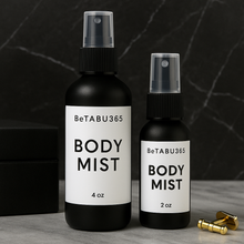 Load image into Gallery viewer, BeTABU365 body mist bottle styled in a polished lifestyle setting for everyday fragrance use Black bottle 
